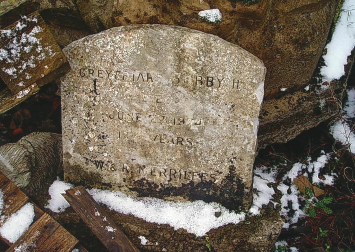 <p>The shocking image that sparked the search for Bobby_s lost grave. The discarded headstone and monument dumped by the roadside.</p>