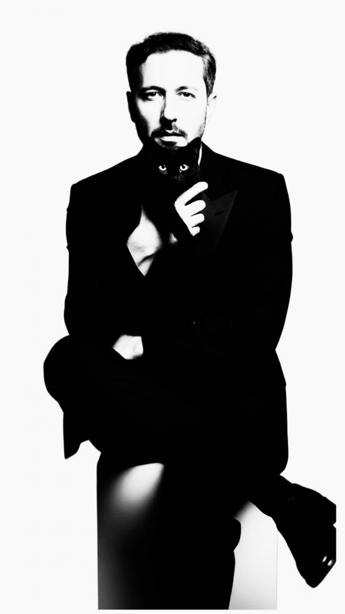 “A black cat named Gypsy – Aunt Chloe’s laid-back companion – lazily lounged atop a chest of drawers, her yellow-green eyes narrowing slightly as they met mine, as if she were silently judging my early rise.“