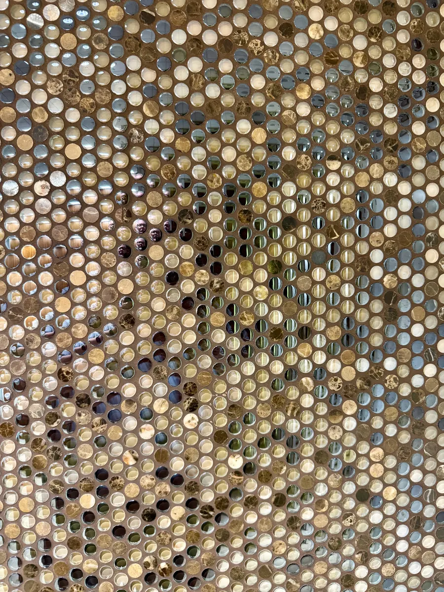 Hand-finished pattern of mirrored and stone discs