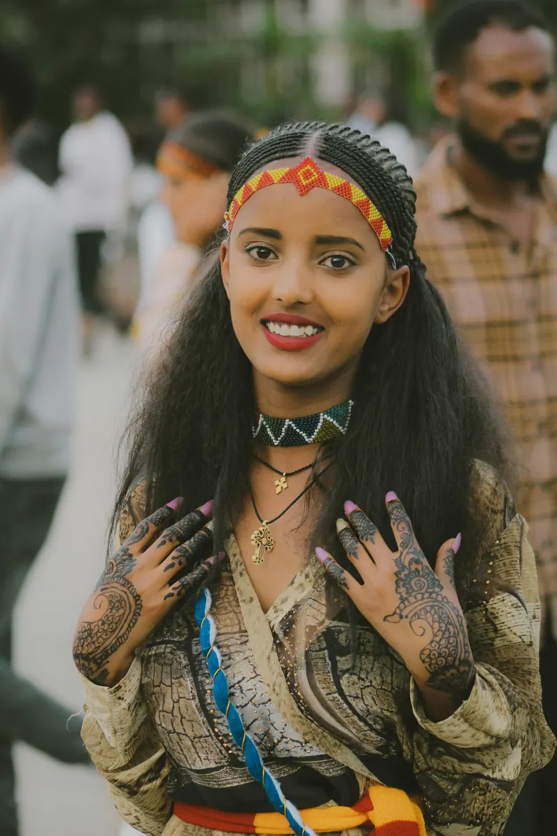 A woman wearing traditional Ethiopian clothing and jewellery