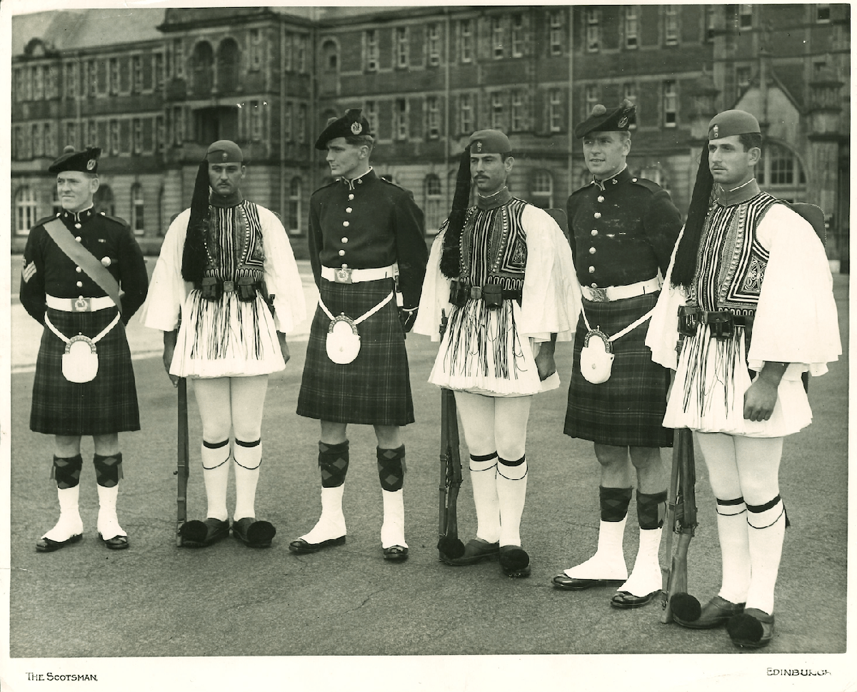 SMK with the Queen's Own Cameron Highlanders and the Evzonoi, of the Greek Royal Guard, at Redford Barracks for the Edinburgh Tattoo in 1960.