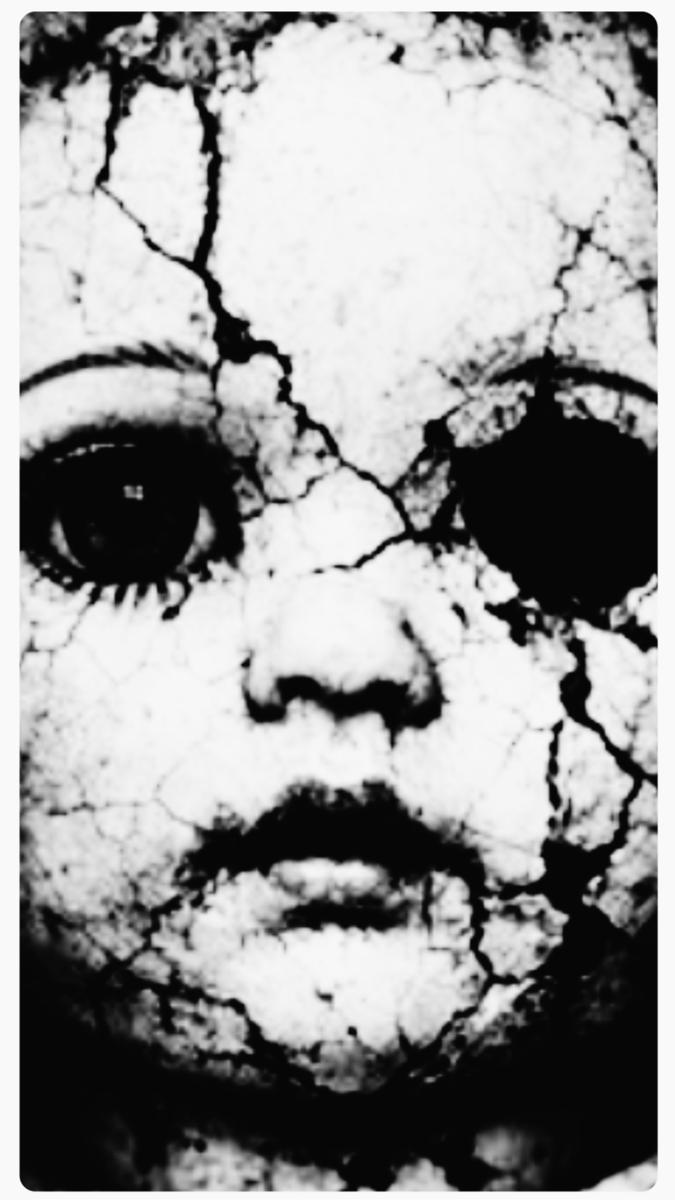 “One fateful afternoon, amidst forgotten relics and cobwebs, I stumbled upon a grimy old doll’s head. It had dishevelled hair that looked as if it had been through countless storms, and one eye was missing, leaving it with an eerie expression.”