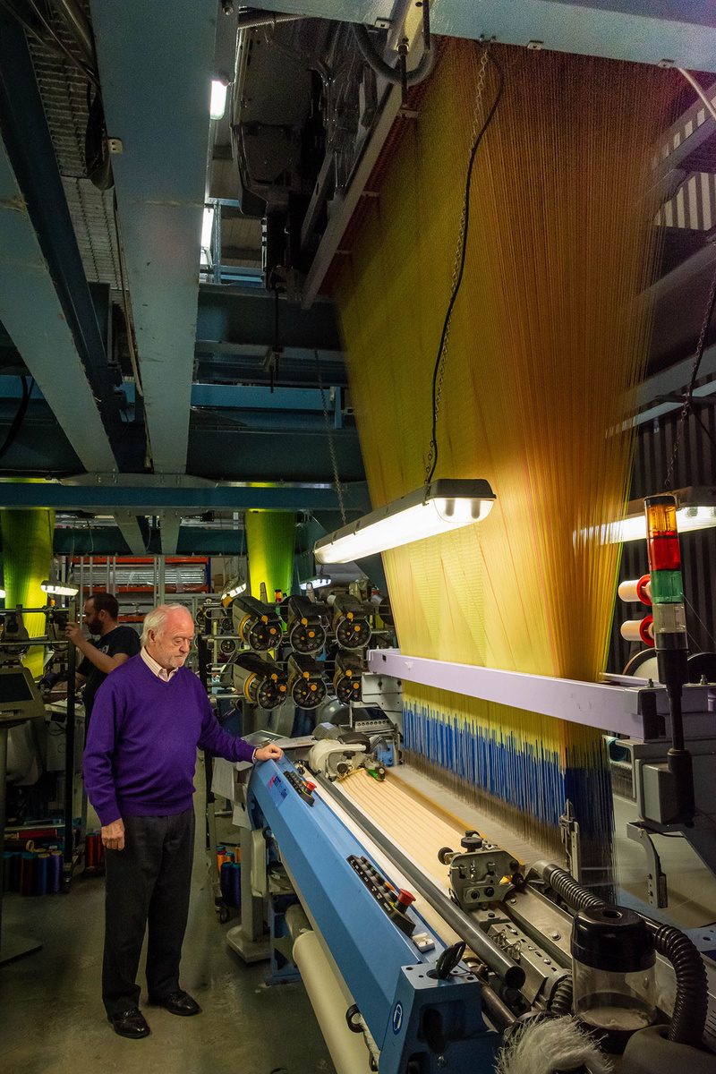 Ron Smart casts an experienced eye over one of his four Italian SMIT Textile silk looms with computer-controlled Jacquard heads
