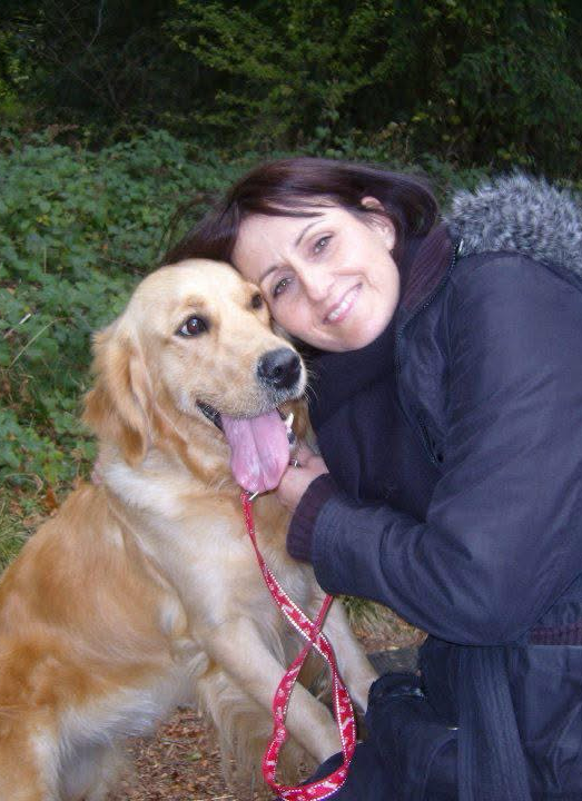 Doreen Connor cuddling her golden retriever, Skye