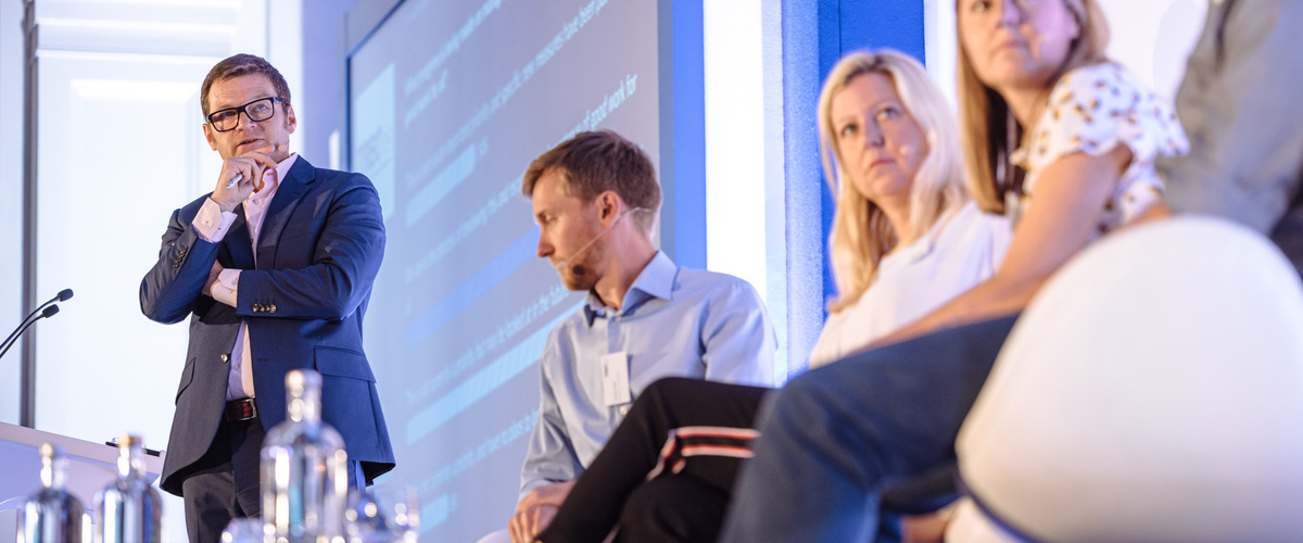 Tom Hadley speaking during a panel discussion with fellow panellists