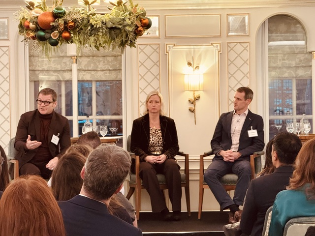 Tom Hadley moderating a panel discussion