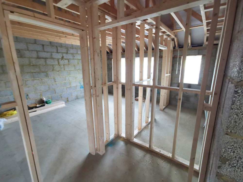Timber stud walls going up inside a blockwork extension