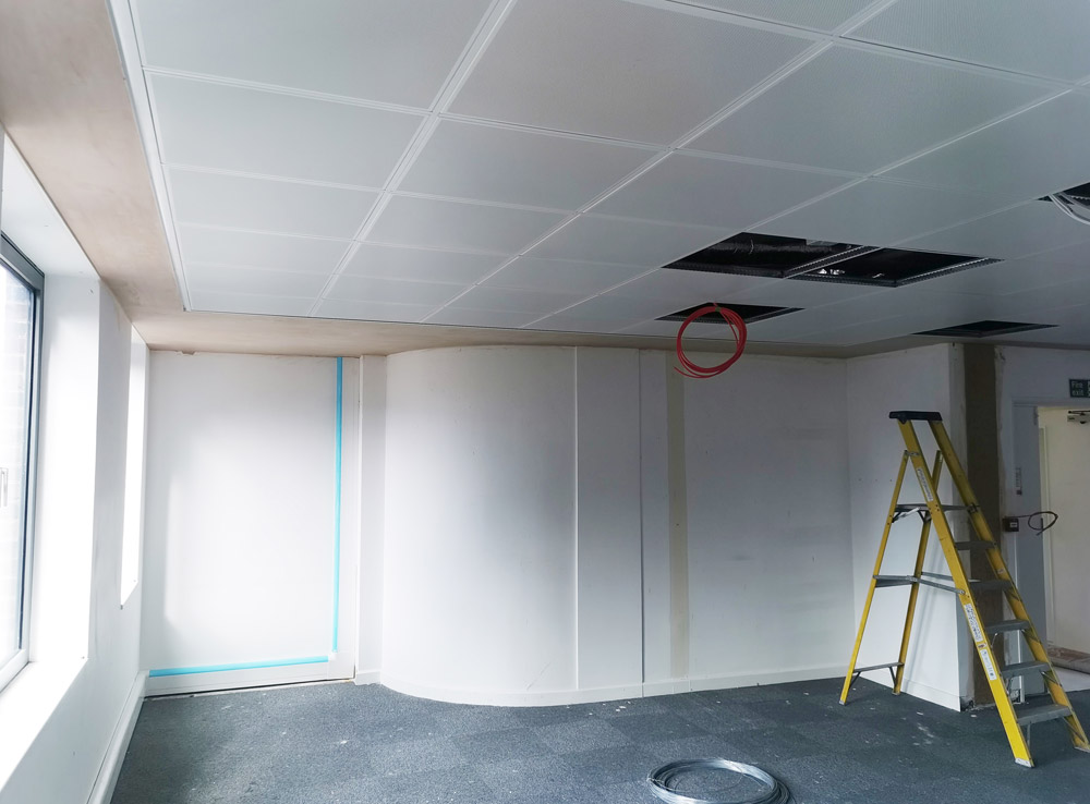 Office refurbishment with new partition walls, a suspended ceiling and a stepladder