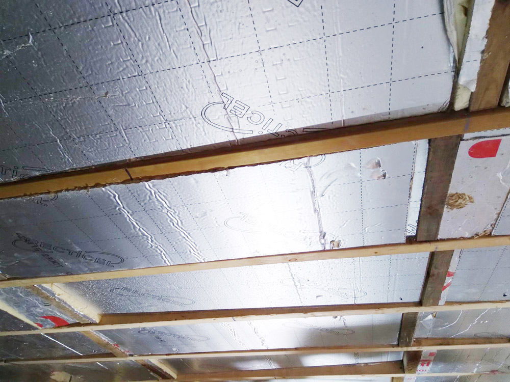 Foil-backed insulation fitted between roof timbers