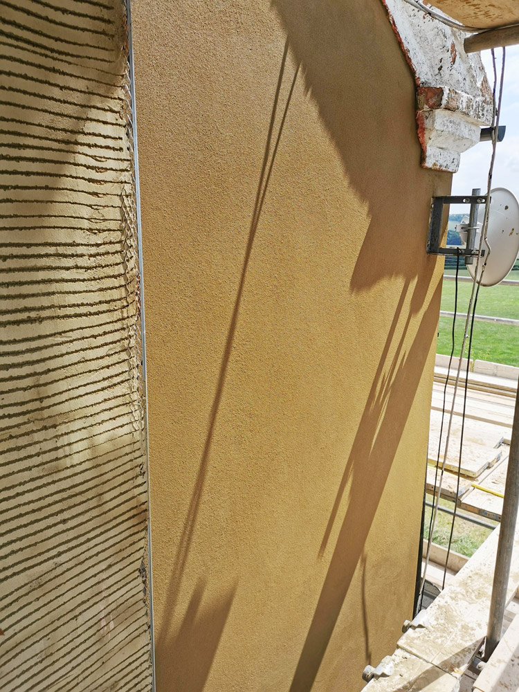 Render being applied to an external wall