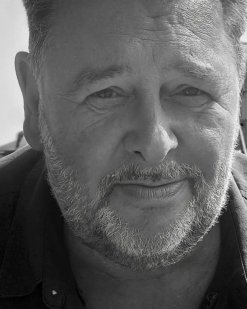 Stephen Howes photographed outdoors