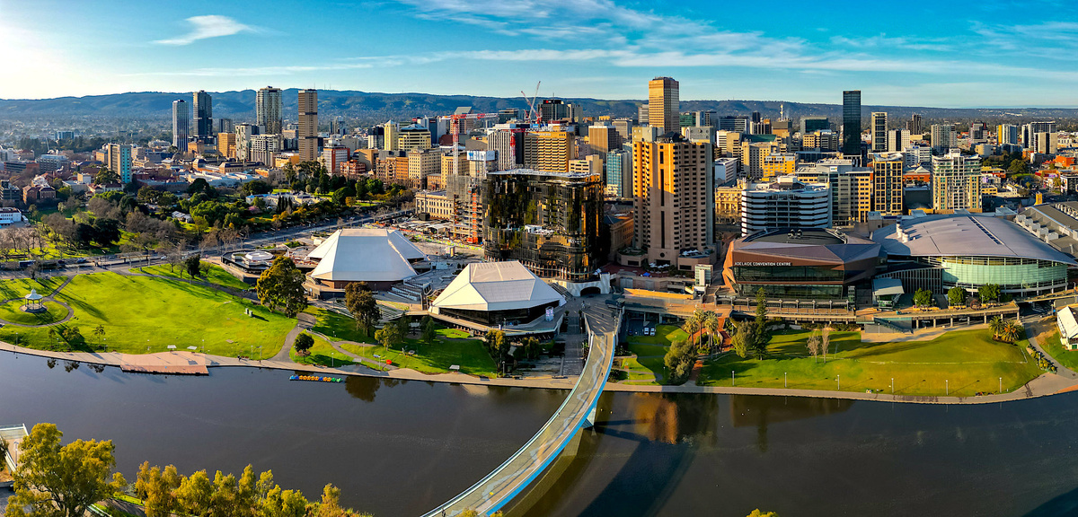 Adelaide, South Australia. The City of Adelaide is laid out as a square mile grid surrounded by parks and gardens, reflecting its English and German heritage.