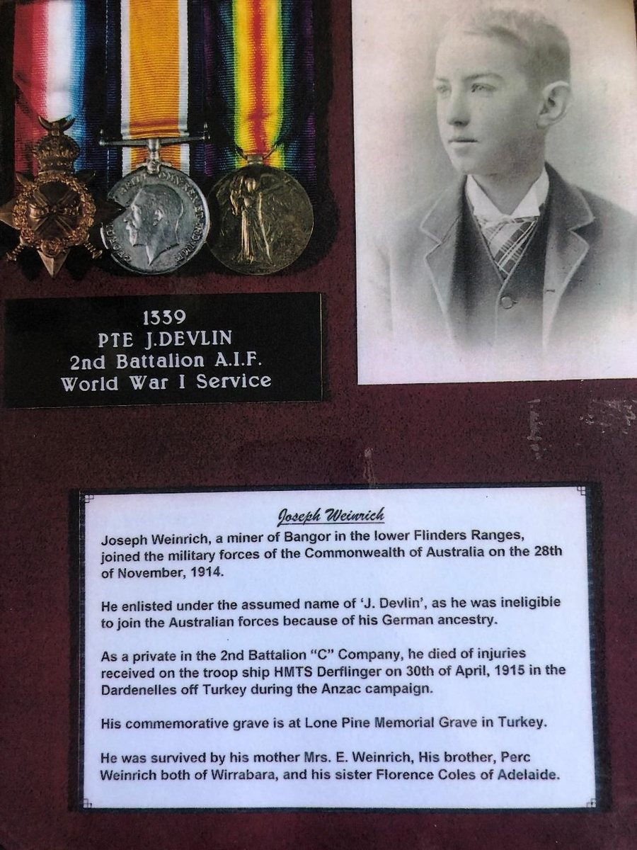 Joseph Weinrich enlisted under the assumed name “J. Devlin”, as he was ineligible to join the Australian forces because of his German ancestry. He died of wounds received during the Anzac campaign in 1915; his commemorative grave is at the Lone Pine Memorial in Turkey.