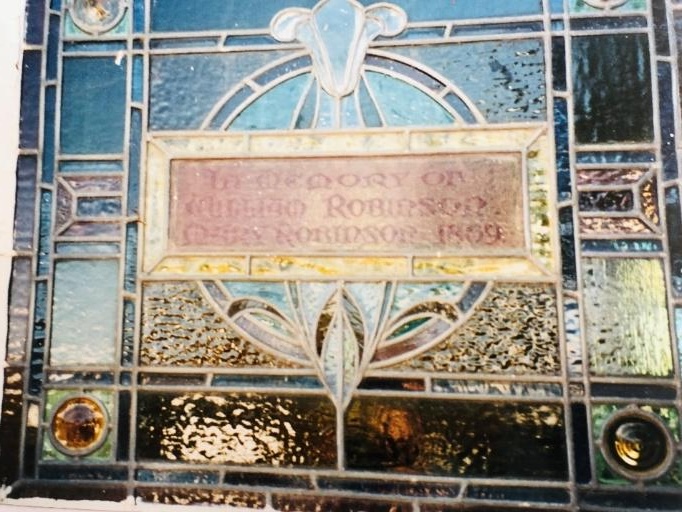 The stained glass window dedicated to the memory of William and Mary Robinson in the Saddleworth Baptist Church.