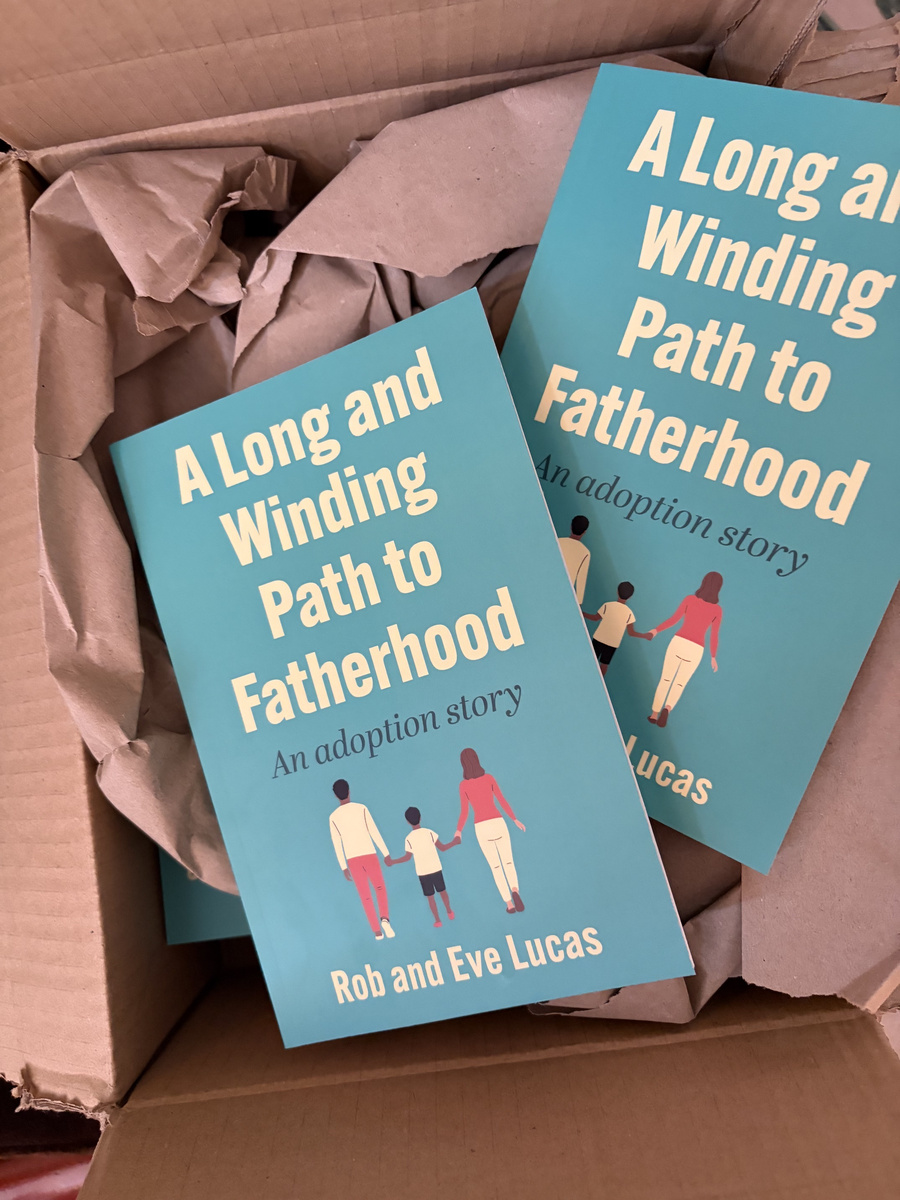 Copies of paperback books in packing box
