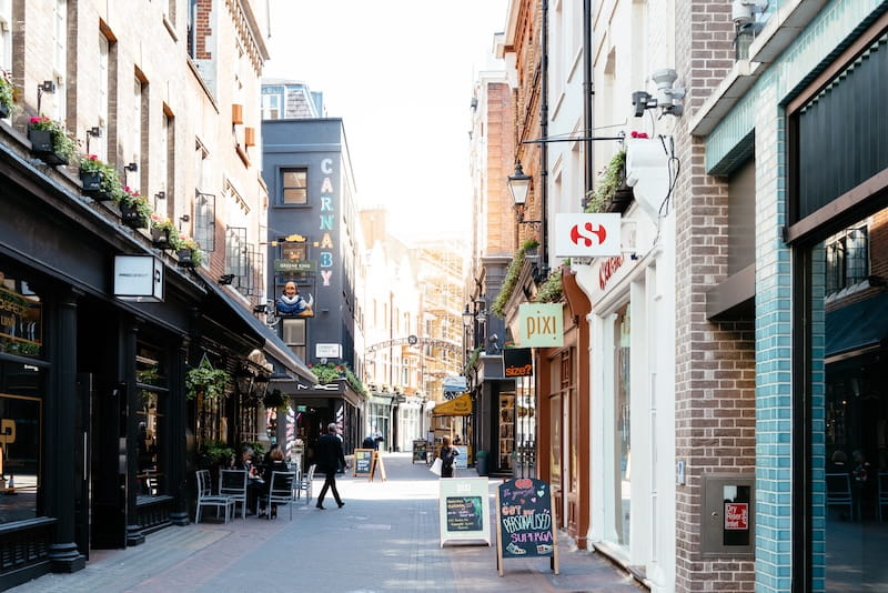 Shopping street with famous luxury clothing stores in Carnaby area in Soho in London