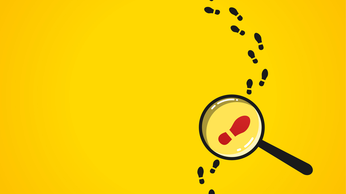 Footprints curving towards a magnifying glass on a yellow background
