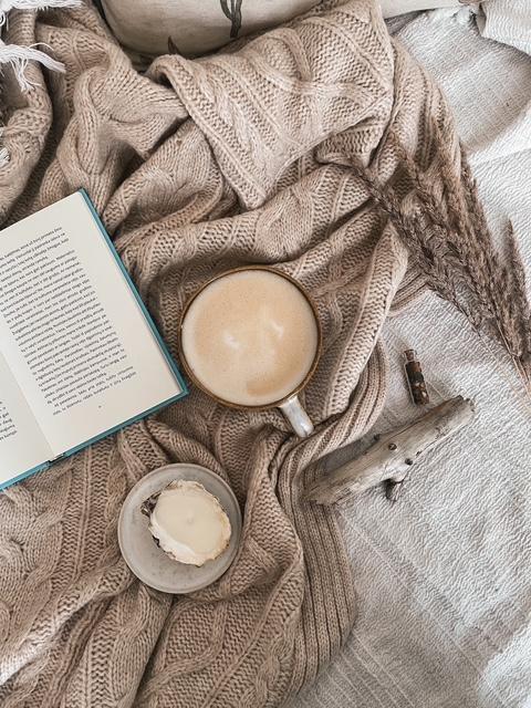 Book and coffee on a blanket